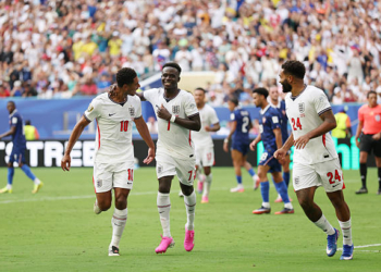 MIAMI GARDENS, FLORIDA - JULY 18: Bukayo Saka #7 of England celebrates scoring his team's fifth and hat trick goal with teammates Jude Bellingham #10 and Reece James #24 during the FIFA World Cup 2026 Bronze Final between France and England at Miami Stadium on July 18, 2026 in Miami Gardens, Florida. (Photo by Luke Hales/Getty Images)